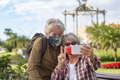 Man photographing with mobile phone