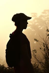 Side view of silhouette boy during sunset