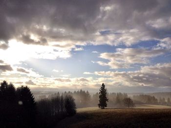 Scenic view of landscape against cloudy sky