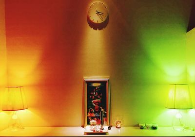 Illuminated electric lamp on wall