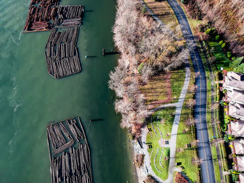 High angle view of wooden posts in lake