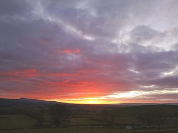 Scenic view of dramatic sky during sunset