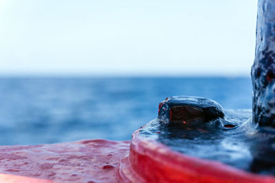 Close-up of sea against clear sky