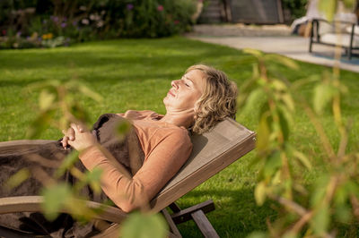 Woman resting on grass