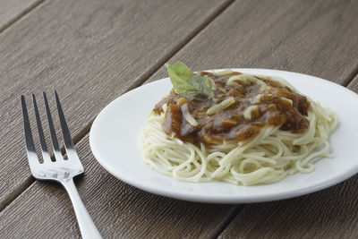 Close-up of noodles served in plate on table