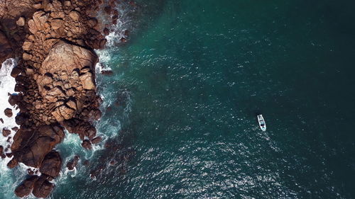 High angle view of rock formation in sea