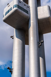 Low angle view of smoke stack against sky