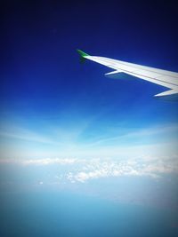 Airplane flying over cloudscape