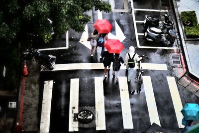 People walking on red road