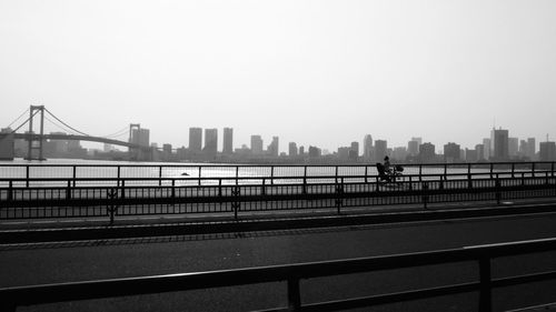 City skyline with bridge in background