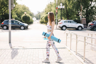 Rear view of woman on street in city