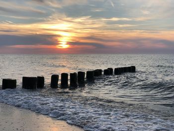 Scenic view of sea against sky during sunset