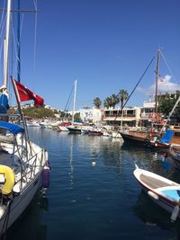 Boats moored at harbor