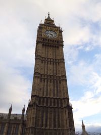 Low angle view of clock tower against sky