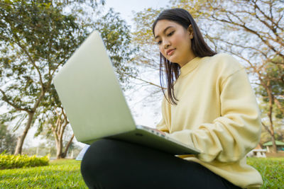 Woman sitting in park