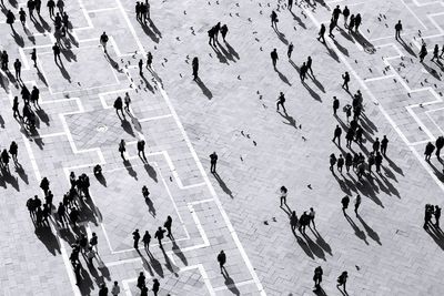 High angle view of crowd at town square during sunny day