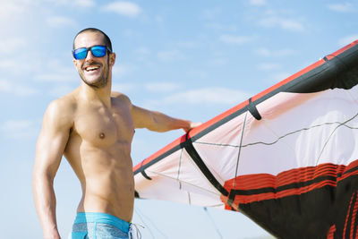 Man windsurfing at beach