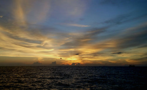 Scenic view of sea at sunset