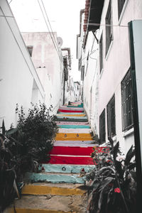 Staircase amidst buildings in city 