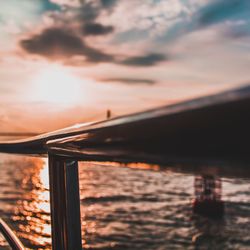 Scenic view of sea against dramatic sky during sunset