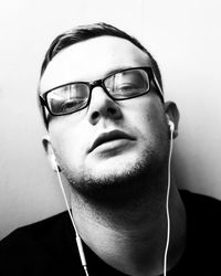 Close-up portrait of young man wearing sunglasses