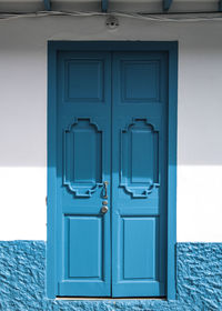 Closed blue door of house