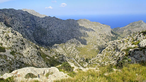 Rock formations on landscape against sky