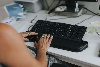 Woman's hands using computer