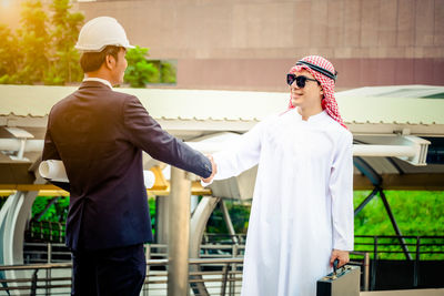 Full length of a young man standing outdoors