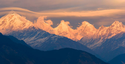 Scenic view of snowcapped mountains against sky