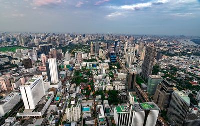 High angle view of modern buildings in city against sky