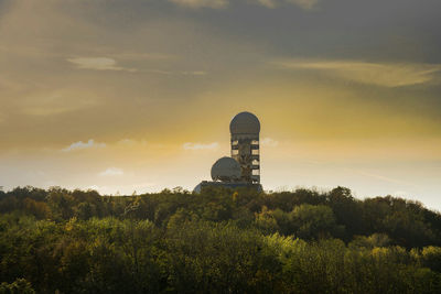 Built structure against cloudy sky during sunset