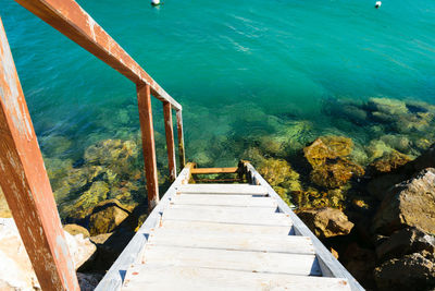 High angle view of stairs by sea