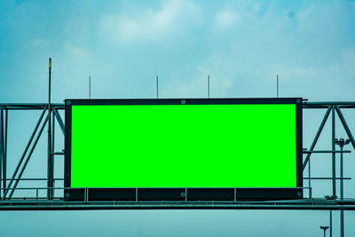 Empty road sign against blue sky