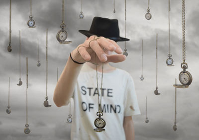 Close-up of person holding pocket watch