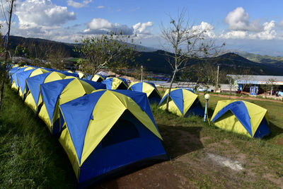 Panoramic view of tent on field against sky