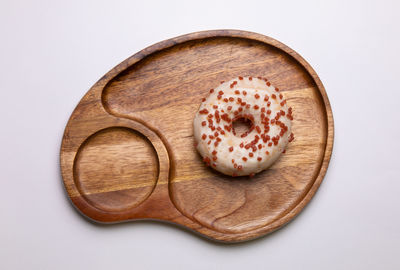 High angle view of cake on table against white background