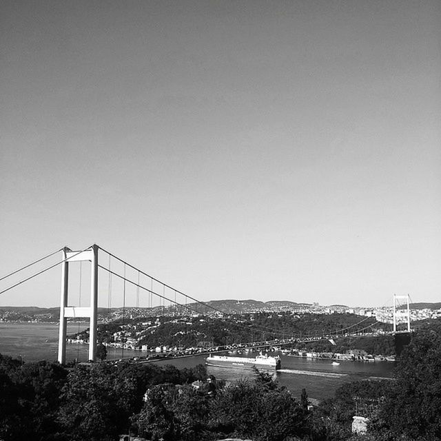 built structure, architecture, connection, bridge - man made structure, clear sky, copy space, engineering, suspension bridge, transportation, water, bridge, river, sea, building exterior, travel destinations, city, outdoors, travel, day, no people