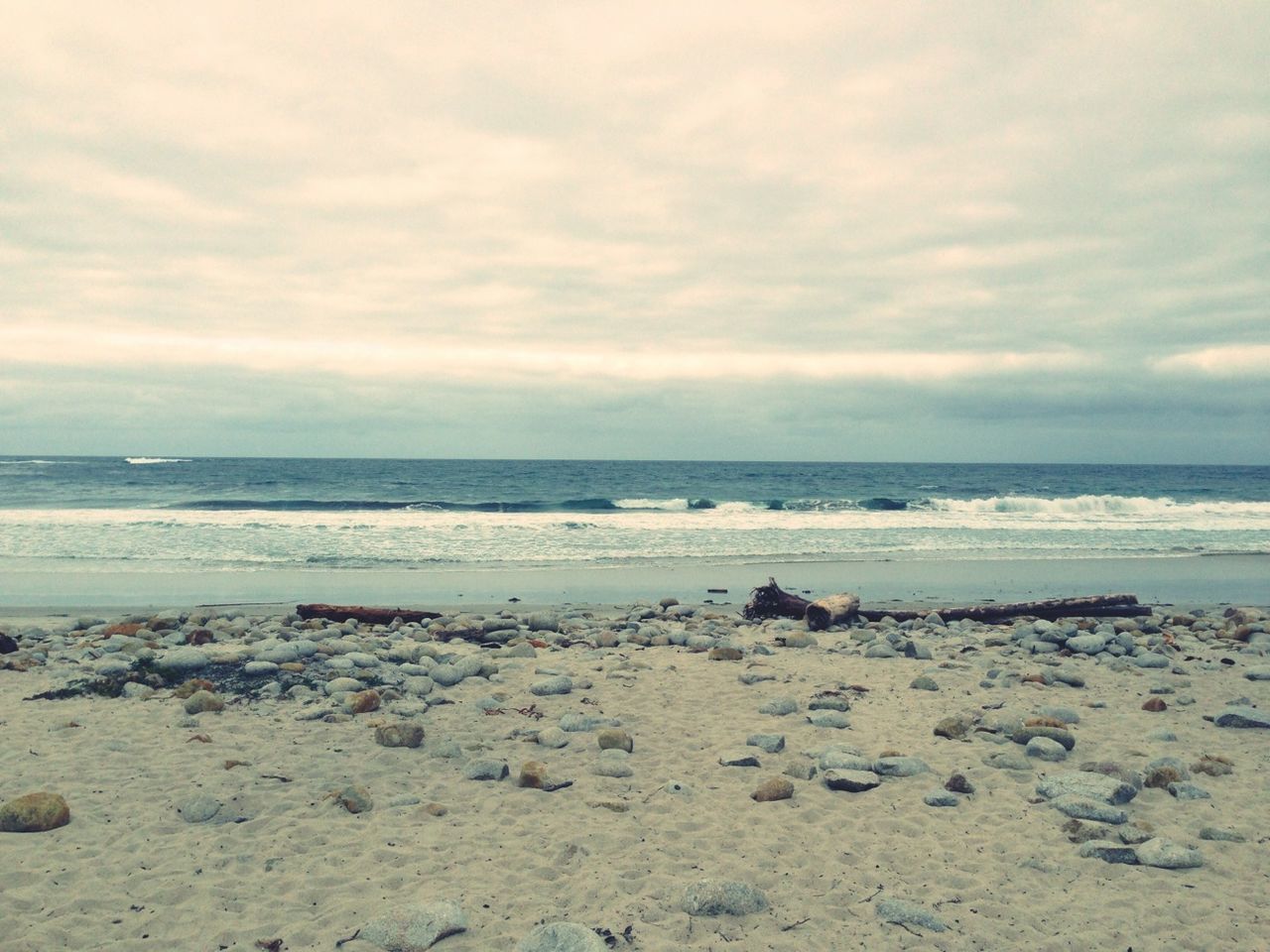 sea, beach, horizon over water, sky, water, shore, tranquil scene, tranquility, scenics, cloud - sky, beauty in nature, cloudy, sand, nature, cloud, idyllic, overcast, coastline, weather, remote