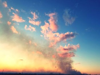 Low angle view of dramatic sky during sunset