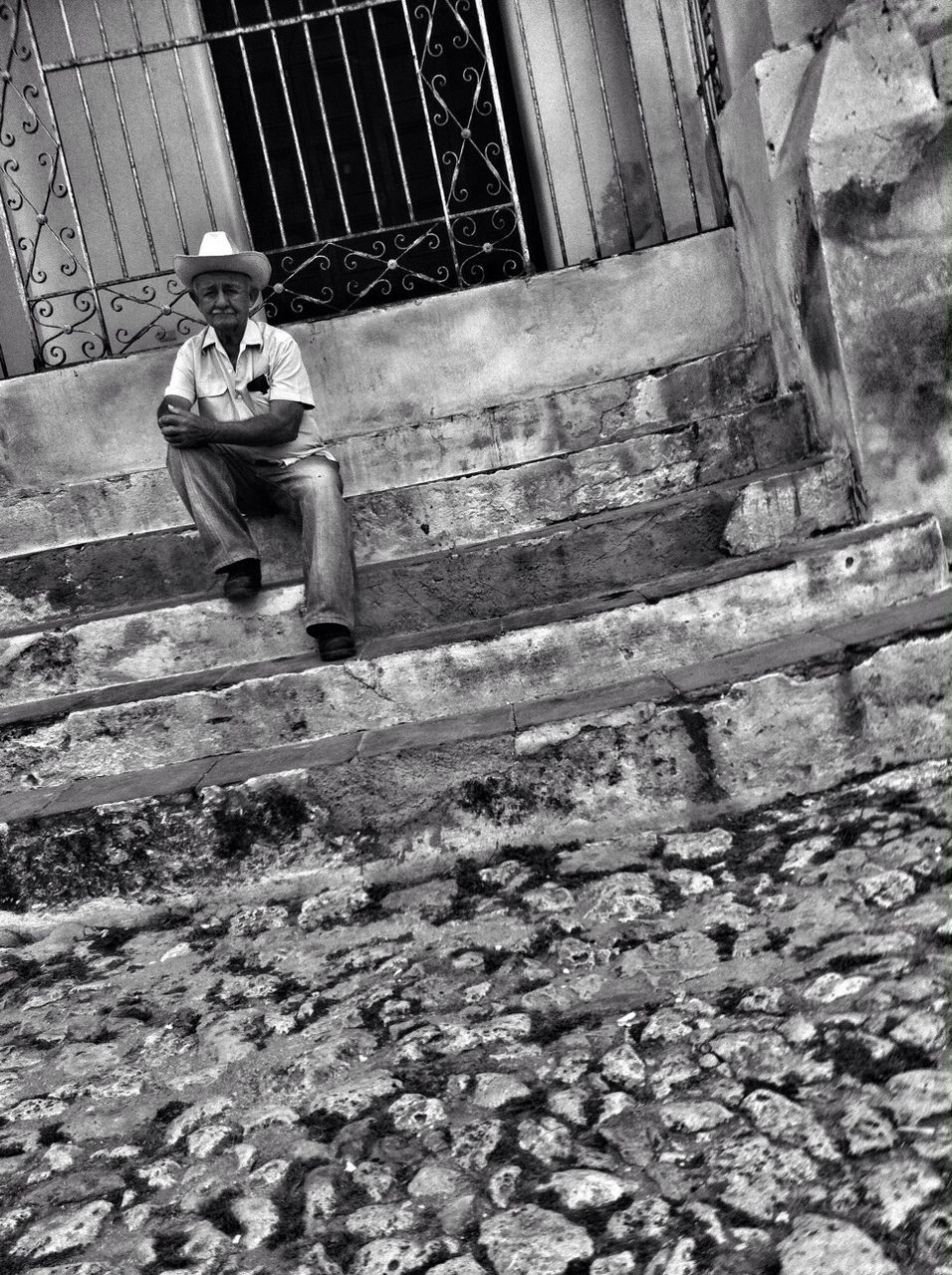 abandoned, built structure, building exterior, architecture, old, obsolete, damaged, day, deterioration, outdoors, steps, working, full length, run-down, transportation, rock - object, stone - object, sitting