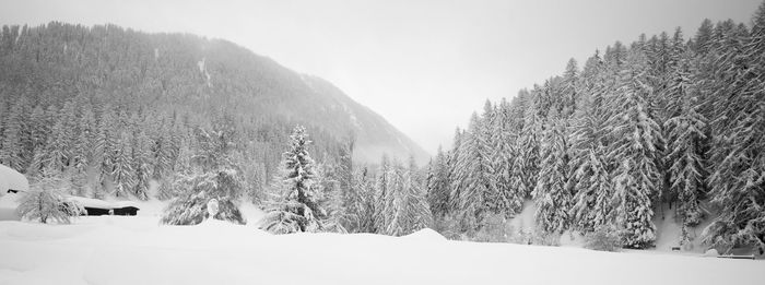 Scenic view of snow covered mountains against sky