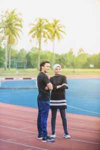 Full length of young man standing on field