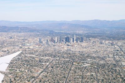 Aerial view of cityscape against sky