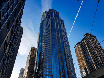Low angle view of modern buildings against sky