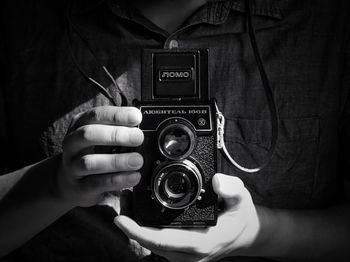 Close-up of hand holding camera