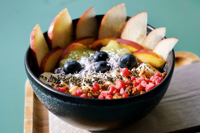 Close-up of açai bowl with fruits on table