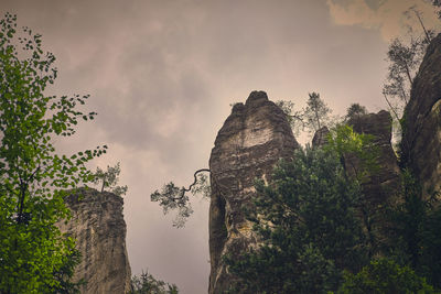 Low angle view of rocks against sky