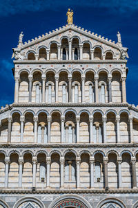 Low angle view of historical building against blue sky