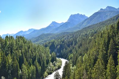 Scenic view of mountains against clear sky during winter